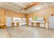 Bright barn interior featuring a full wall of white cabinets and ample open space for storage at 7849 Circle L Trl, Rougemont, NC 27572