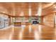 Spacious open-concept living area with wood floors, stone fireplace, and direct access to the kitchen area at 7849 Circle L Trl, Rougemont, NC 27572