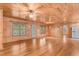 Living room area with wood ceiling, hardwood floors, and sliding door to exterior at 7849 Circle L Trl, Rougemont, NC 27572