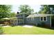 This home features a brick patio and green lawn, perfect for outdoor living and entertaining at 8201 Blue Heron Way, Raleigh, NC 27615