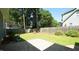 A lovely brick patio and lush lawn for outdoor entertaining at 8201 Blue Heron Way, Raleigh, NC 27615