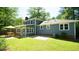 This home features a brick patio and green lawn, perfect for outdoor living and entertaining at 8201 Blue Heron Way, Raleigh, NC 27615