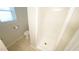 Clean bathroom featuring a walk-in shower with neutral tile flooring at 8201 Blue Heron Way, Raleigh, NC 27615