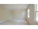 Bright bedroom with neutral paint and two large windows at 8201 Blue Heron Way, Raleigh, NC 27615