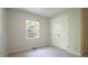 Cozy bedroom with carpet flooring, a large double closet, and a window at 8201 Blue Heron Way, Raleigh, NC 27615
