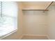 Walk-in closet with built-in shelving and ample storage space at 8201 Blue Heron Way, Raleigh, NC 27615