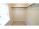 Walk-in closet with rod and shelves for organized storage at 8201 Blue Heron Way, Raleigh, NC 27615
