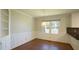 Dining area features wainscoting, a large window, and built-in shelving at 8201 Blue Heron Way, Raleigh, NC 27615