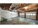 Spacious two car garage with exposed ceiling, white doors, and plenty of room for cars and storage at 8201 Blue Heron Way, Raleigh, NC 27615