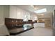 Gourmet kitchen with stainless steel appliances, tiled backsplash, and skylight at 8201 Blue Heron Way, Raleigh, NC 27615
