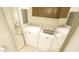 Bright laundry room with cabinets, new washer and dryer at 8201 Blue Heron Way, Raleigh, NC 27615