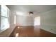 Inviting living room with wood floors and view of kitchen at 8201 Blue Heron Way, Raleigh, NC 27615