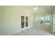The sunroom has a ceiling fan and multiple windows at 8201 Blue Heron Way, Raleigh, NC 27615