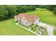 Aerial view showcasing a large home with well-maintained landscaping at 8415 Meadow View Ln, Bahama, NC 27503