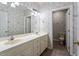 Bathroom features double sinks, tile floors and wallpaper at 8415 Meadow View Ln, Bahama, NC 27503