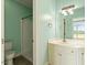 Bright bathroom featuring a white vanity, tile floor, and walk-in shower at 8415 Meadow View Ln, Bahama, NC 27503