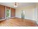 Cozy bedroom with natural light, ceiling fan, and access to an adjacent bathroom at 8415 Meadow View Ln, Bahama, NC 27503