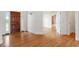 Inviting entryway featuring beautiful hardwood floors and a solid wood front door at 8415 Meadow View Ln, Bahama, NC 27503