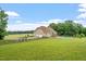 Lawn, mature trees and fenced pool view of home at 8415 Meadow View Ln, Bahama, NC 27503