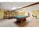 Spacious game room with tile floors, pool table, ping pong table and shelves at 8415 Meadow View Ln, Bahama, NC 27503