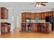 Spacious kitchen with a central island, stainless steel appliances and cozy breakfast bar at 8415 Meadow View Ln, Bahama, NC 27503