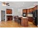 Spacious kitchen with a central island, stainless steel appliances and cozy breakfast bar at 8415 Meadow View Ln, Bahama, NC 27503
