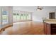 Bright and open living area with kitchen views, natural light and hardwood floors at 8415 Meadow View Ln, Bahama, NC 27503