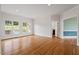 Open living room featuring hardwood floors, recessed lighting, and an adjacent outdoor pool view at 8415 Meadow View Ln, Bahama, NC 27503