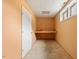 Small room features a built in desk, concrete floors and orange painted walls at 8415 Meadow View Ln, Bahama, NC 27503