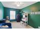 Bright bedroom with ample natural light and a comfortable seating area at 8620 Neuse Club Ln # 107, Raleigh, NC 27616