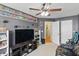Comfortable bonus room equipped with a ceiling fan and large shelving at 8620 Neuse Club Ln # 107, Raleigh, NC 27616