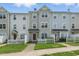 Charming townhome featuring a well-maintained front lawn and inviting entrance at 8620 Neuse Club Ln # 107, Raleigh, NC 27616