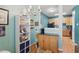 Cozy dining area adjacent to a modern kitchen with warm wood cabinets at 8620 Neuse Club Ln # 107, Raleigh, NC 27616