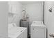 Functional laundry room with washer and dryer at 8620 Neuse Club Ln # 107, Raleigh, NC 27616