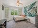 Bedroom featuring ceiling fan, hanging chair and large window with natural light at 903 Grace Point Rd, Morrisville, NC 27560
