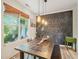 Charming dining room featuring a rustic wood table and chalkboard wall, perfect for Gathering gatherings at 903 Grace Point Rd, Morrisville, NC 27560