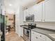 Bright kitchen features stainless appliances and ample counter space for cooking at 903 Grace Point Rd, Morrisville, NC 27560