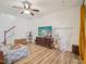 Bright living room featuring hardwood floors, a hanging hammock chair, and stylish furniture at 903 Grace Point Rd, Morrisville, NC 27560