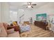 Inviting living room with wood floors, comfortable seating, and plenty of natural light at 903 Grace Point Rd, Morrisville, NC 27560