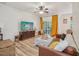 Comfortable living room featuring hardwood floors, ample natural light, and stylish décor at 903 Grace Point Rd, Morrisville, NC 27560