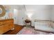 Bright Bedroom with a wooden crib and colorful decor, creating a cheerful and inviting space for a little one at 1100 Brooks Ave, Raleigh, NC 27607