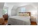 Bright bedroom with a sloped ceiling, a comfortable bed, and natural light streaming through the windows at 1100 Brooks Ave, Raleigh, NC 27607