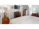 Cozy bedroom featuring a plush bed, coordinating decor, and a view into an adjacent room, creating a welcoming space at 1100 Brooks Ave, Raleigh, NC 27607