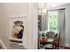 Dining room with decorative shelf niche displaying decor next to the table and chairs at 1100 Brooks Ave, Raleigh, NC 27607