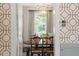 View through doorway of dining room with hardwood floors, chandelier, table, and chairs at 1100 Brooks Ave, Raleigh, NC 27607