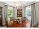 Formal dining room featuring a wood table, detailed chairs, and decorative cabinet at 1100 Brooks Ave, Raleigh, NC 27607
