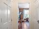 Foyer view leading into the living room with hardwood floors and a neutral color palette at 1100 Brooks Ave, Raleigh, NC 27607
