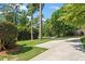 Well-manicured front yard with lush green lawn and mature landscaping at 1100 Brooks Ave, Raleigh, NC 27607