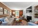 Comfortable living room featuring a fireplace, neutral furniture, and stylish decor at 1100 Brooks Ave, Raleigh, NC 27607