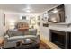 Cozy living room with a fireplace, stylish sofa, and decorative accents at 1100 Brooks Ave, Raleigh, NC 27607